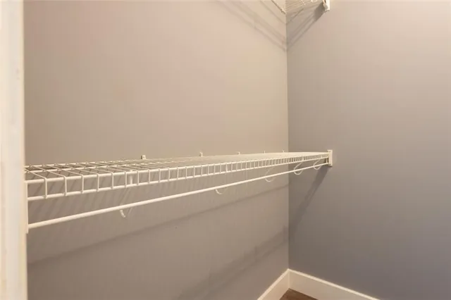 a view of a refrigerator with wooden floor