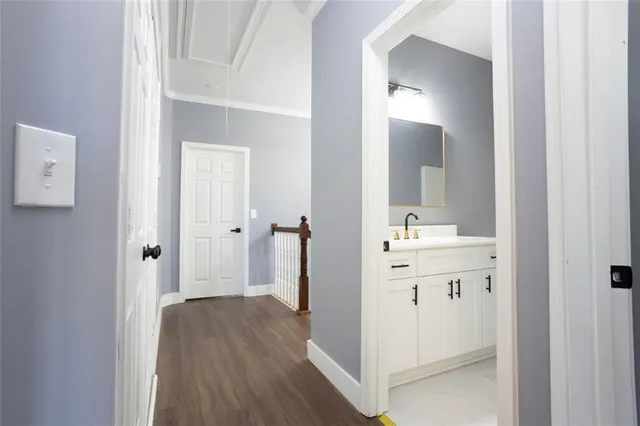 a bathroom with a sink a mirror and a shower