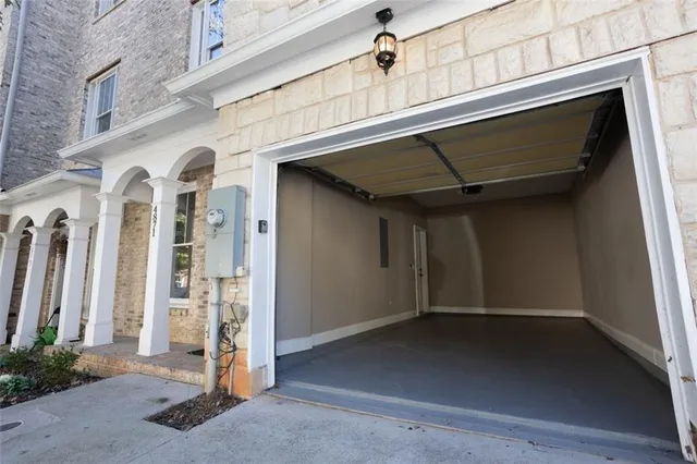 a view of front door and small yard