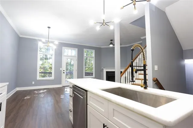 a view of kitchen and sink with wooden floor