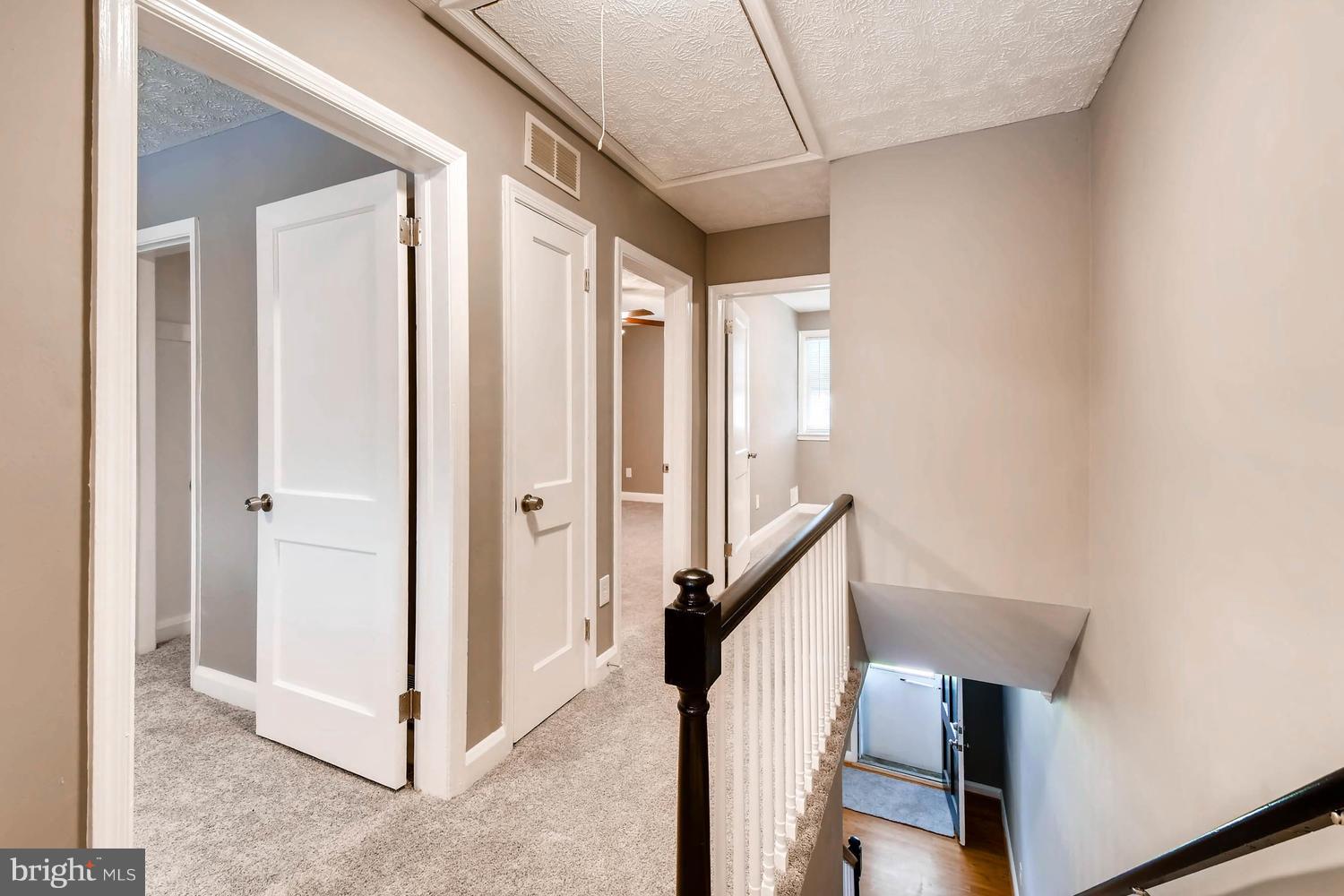 2210 Redthorn Road Middle River, MD 21220 - Photo 12 of 30 HALLWAY WITH ATTIC PULLDOWN STAIRS