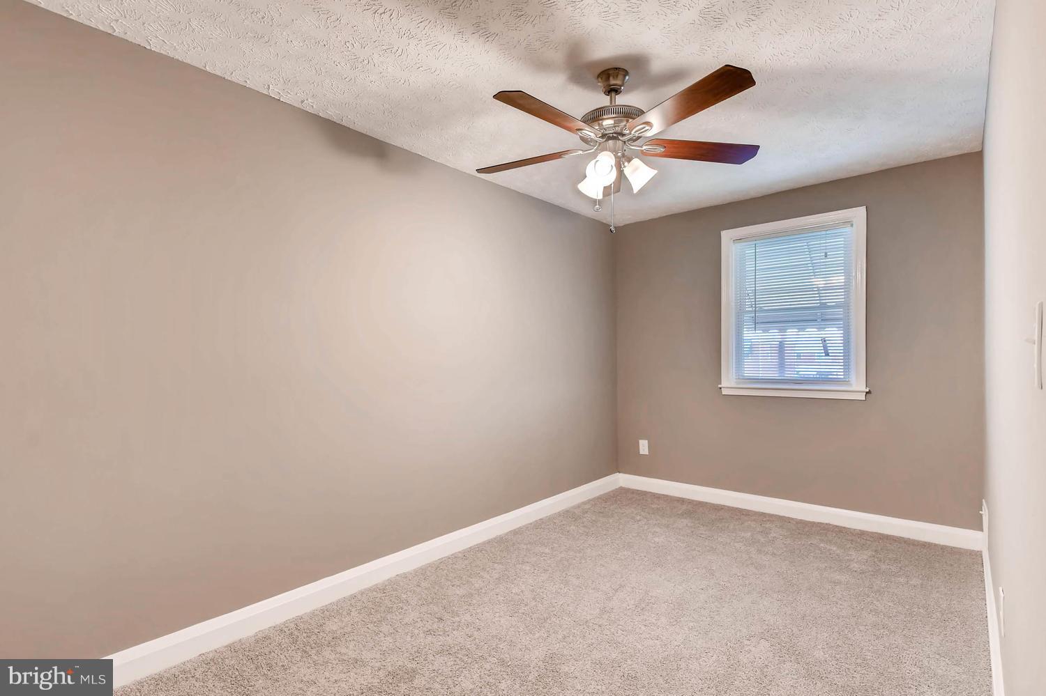2210 Redthorn Road Middle River, MD 21220 - Photo 13 of 30 MASTER BEDROOM WITH CEILING FAN AND LIGHT FIXTURE
