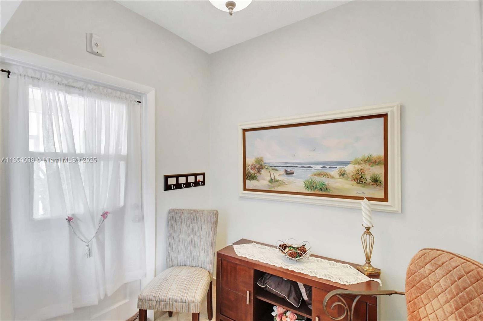 415 Northeast 2nd Street, Unit 201 Hallandale Beach, FL 33009 - Photo 13 of 34 a bathroom with a sink and a mirror
