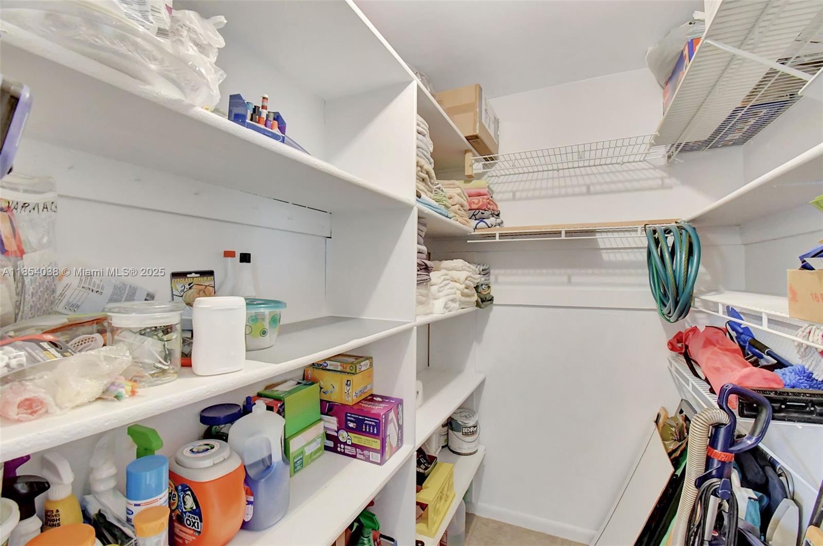 415 Northeast 2nd Street, Unit 201 Hallandale Beach, FL 33009 - Photo 16 of 34 a storage & utility room with furniture and toys