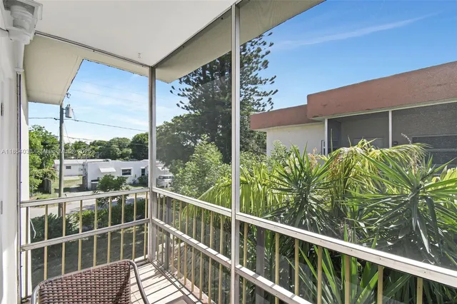 a view of a balcony with chairs