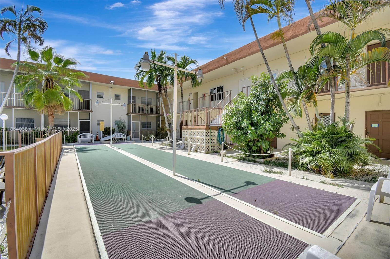 415 Northeast 2nd Street, Unit 201 Hallandale Beach, FL 33009 - Photo 33 of 34 a swimming pool with outdoor seating and yard