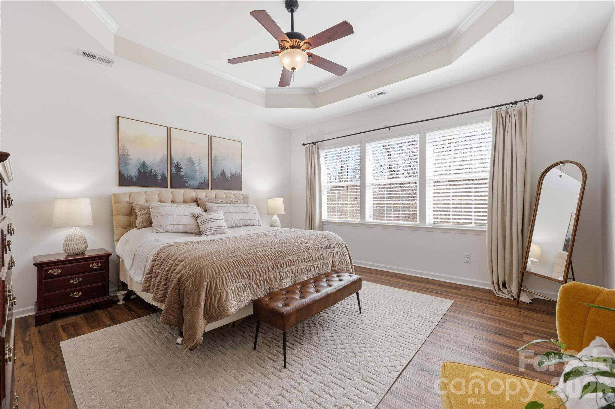 1210 Gold Rush Court Fort Mill, SC 29708 - Photo 15 of 39 a bedroom with a bed and wooden floor
