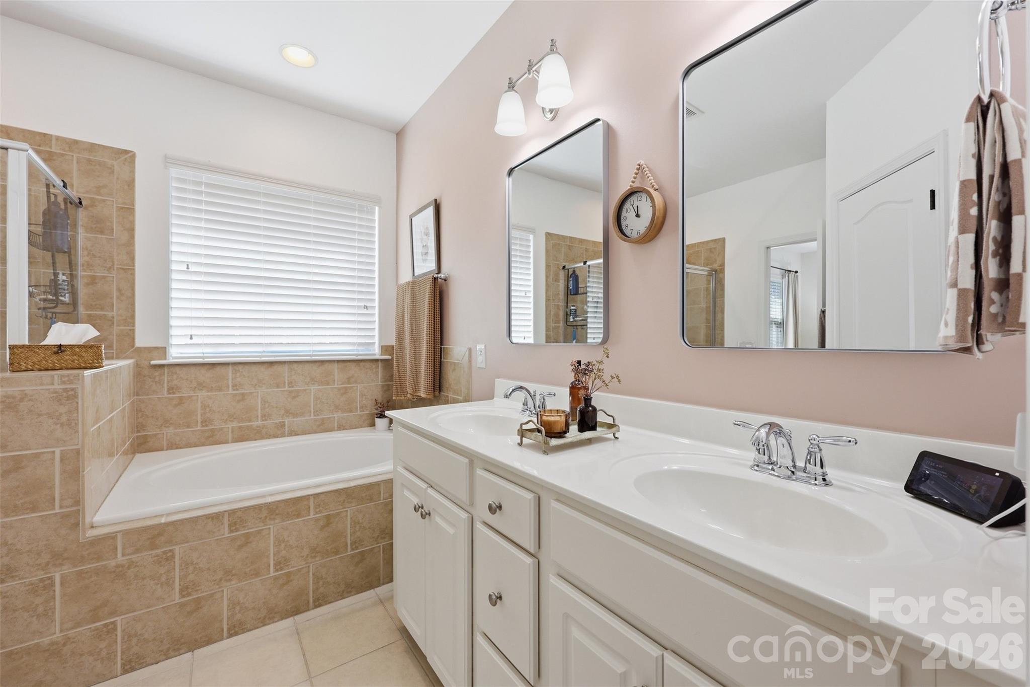 1210 Gold Rush Court Fort Mill, SC 29708 - Photo 17 of 39 a bathroom with a granite countertop sink mirror and a bathtub