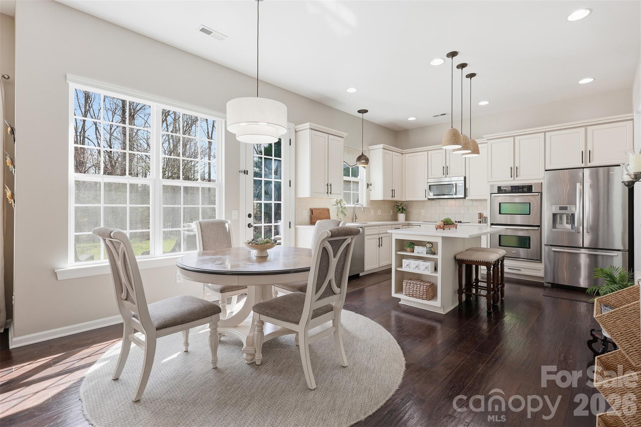1210 Gold Rush Court Fort Mill, SC 29708 - Photo 2 of 39 a view of a dining room with furniture window and wooden floor
