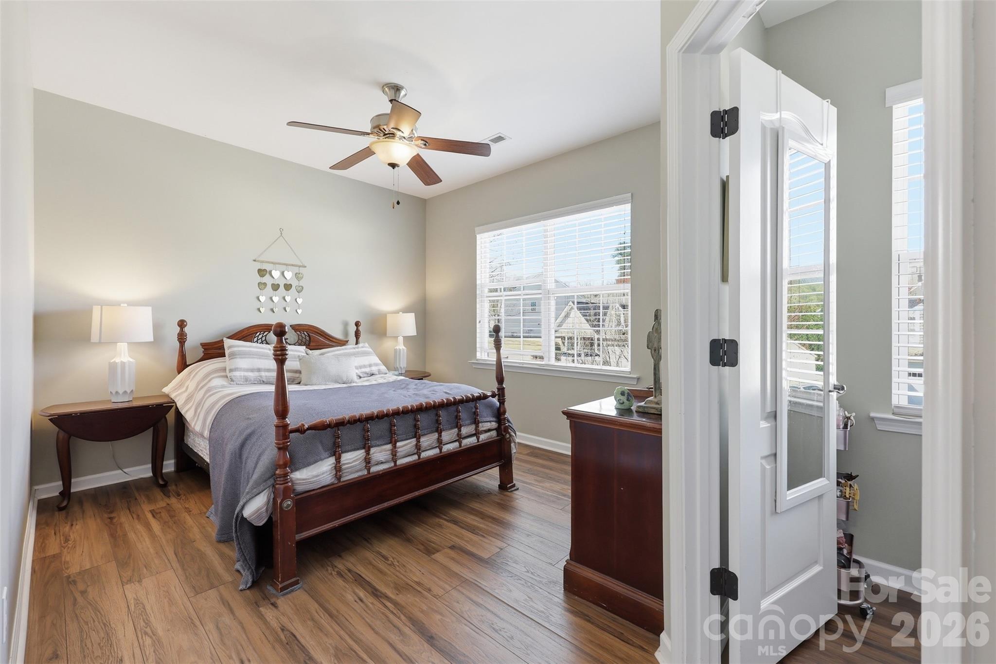 1210 Gold Rush Court Fort Mill, SC 29708 - Photo 21 of 39 a bedroom with a bed and wooden floor