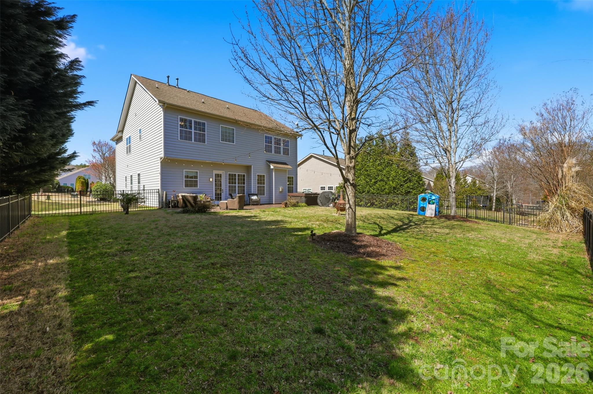 1210 Gold Rush Court Fort Mill, SC 29708 - Photo 25 of 39 a view of a white house with a big yard and large trees