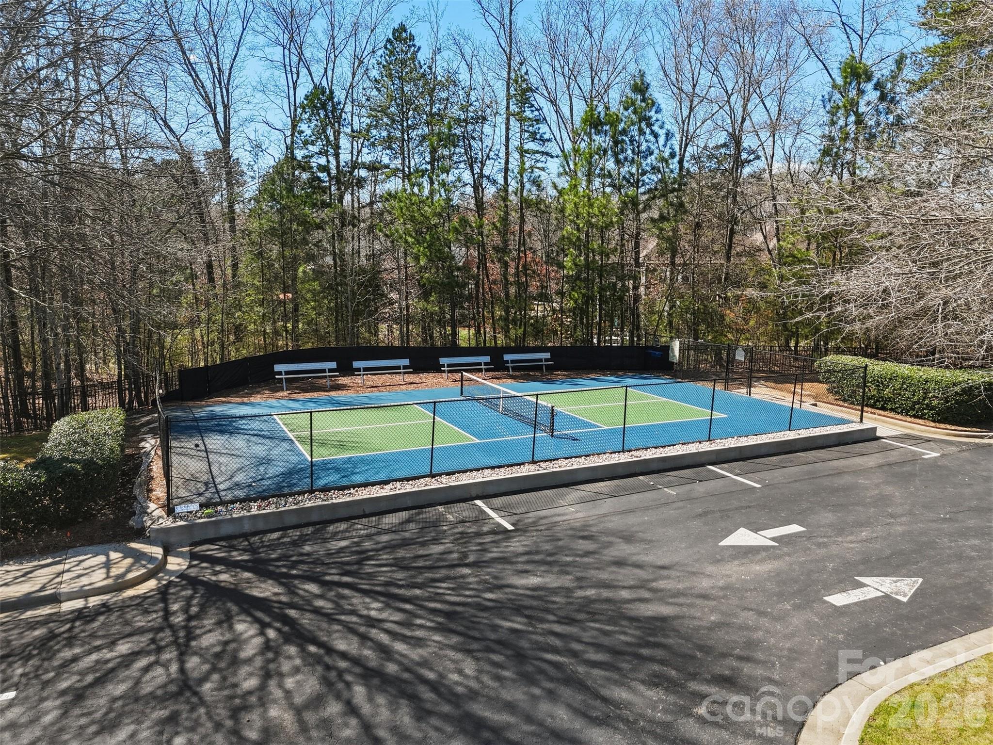 1210 Gold Rush Court Fort Mill, SC 29708 - Photo 33 of 39 a view of a tennis ground with large trees