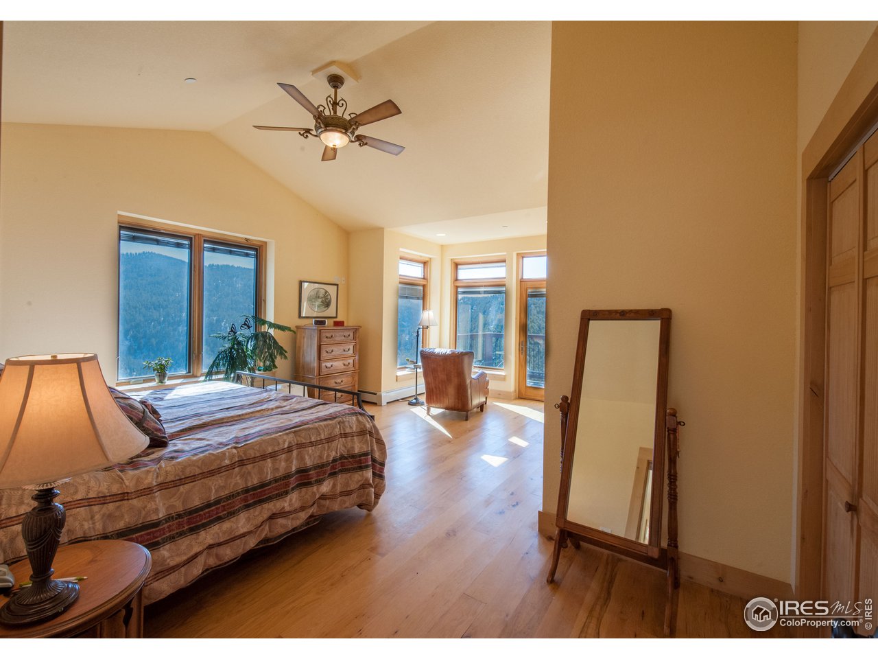 4900 Ridge Road Boulder, CO 80302 - Photo 15 of 38 a bedroom with bed and wooden floor