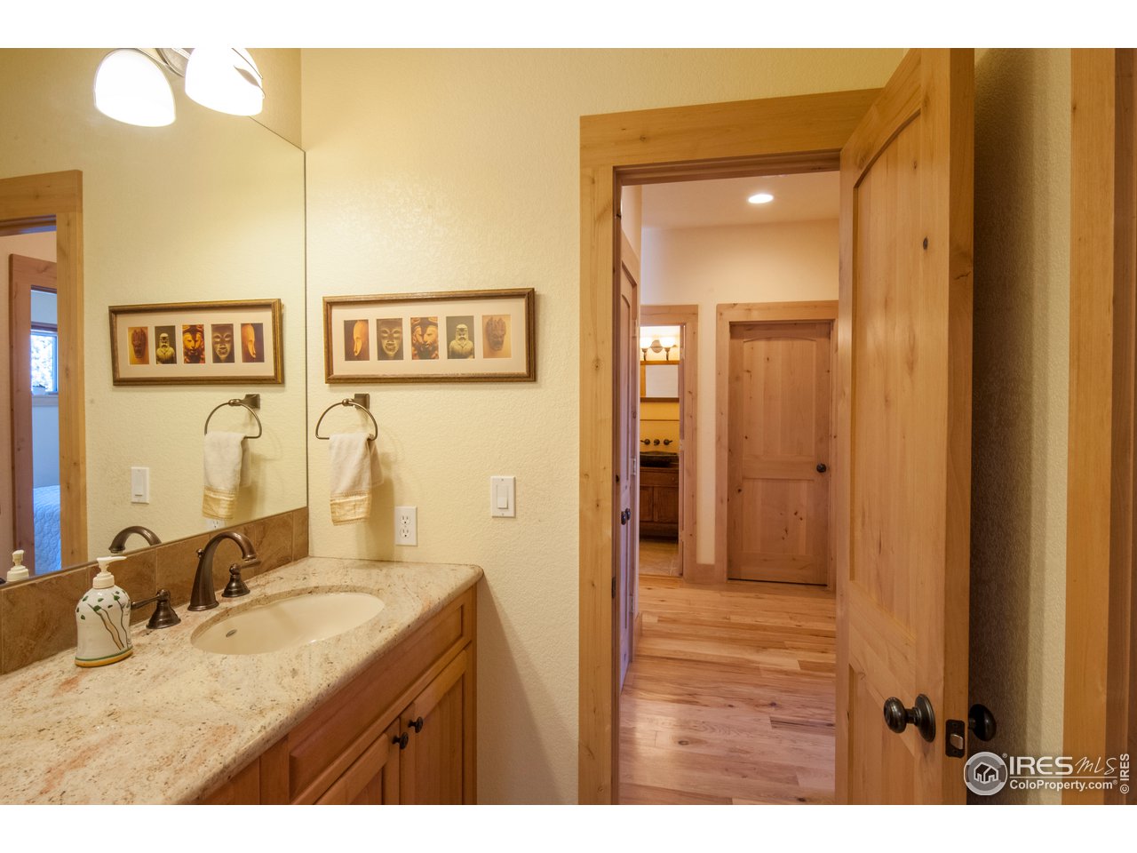 4900 Ridge Road Boulder, CO 80302 - Photo 26 of 38 a bathroom with a granite countertop sink and a mirror