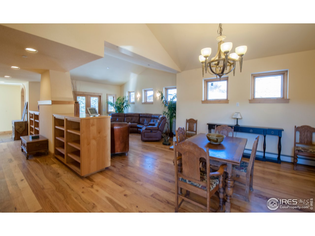 4900 Ridge Road Boulder, CO 80302 - Photo 4 of 38 a living room with furniture a dining table and a chandelier