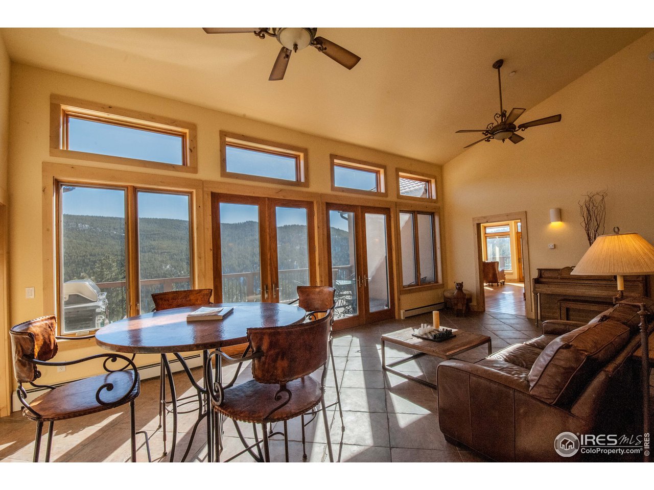 4900 Ridge Road Boulder, CO 80302 - Photo 6 of 38 a living room with furniture a table and a large window
