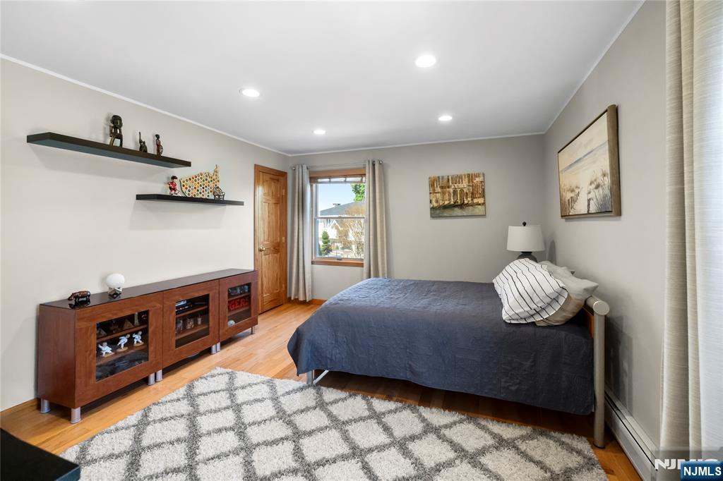 66 Roehrs Drive Wallington, NJ 07057 - Photo 19 of 37 a bedroom with a bed and dresser