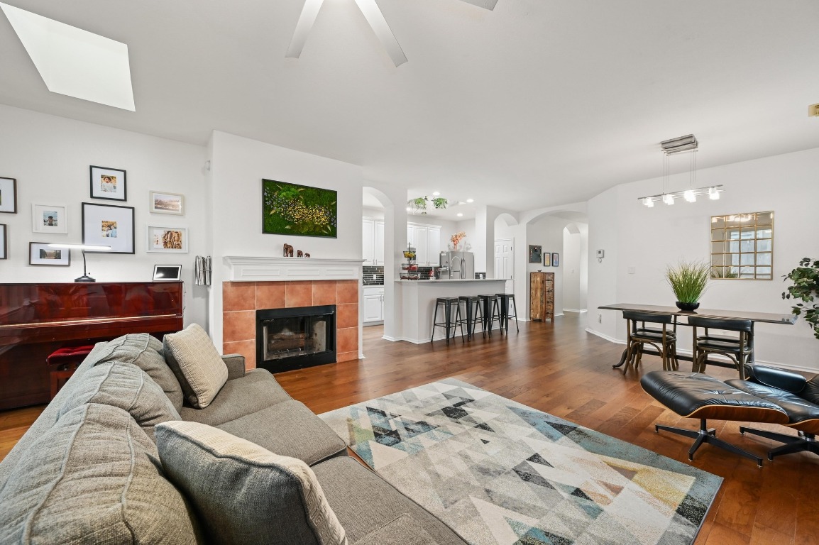 2721 Kinney Oaks Court Austin, TX 78704 - Photo 14 of 28 a living room with furniture a flat screen tv and a fireplace