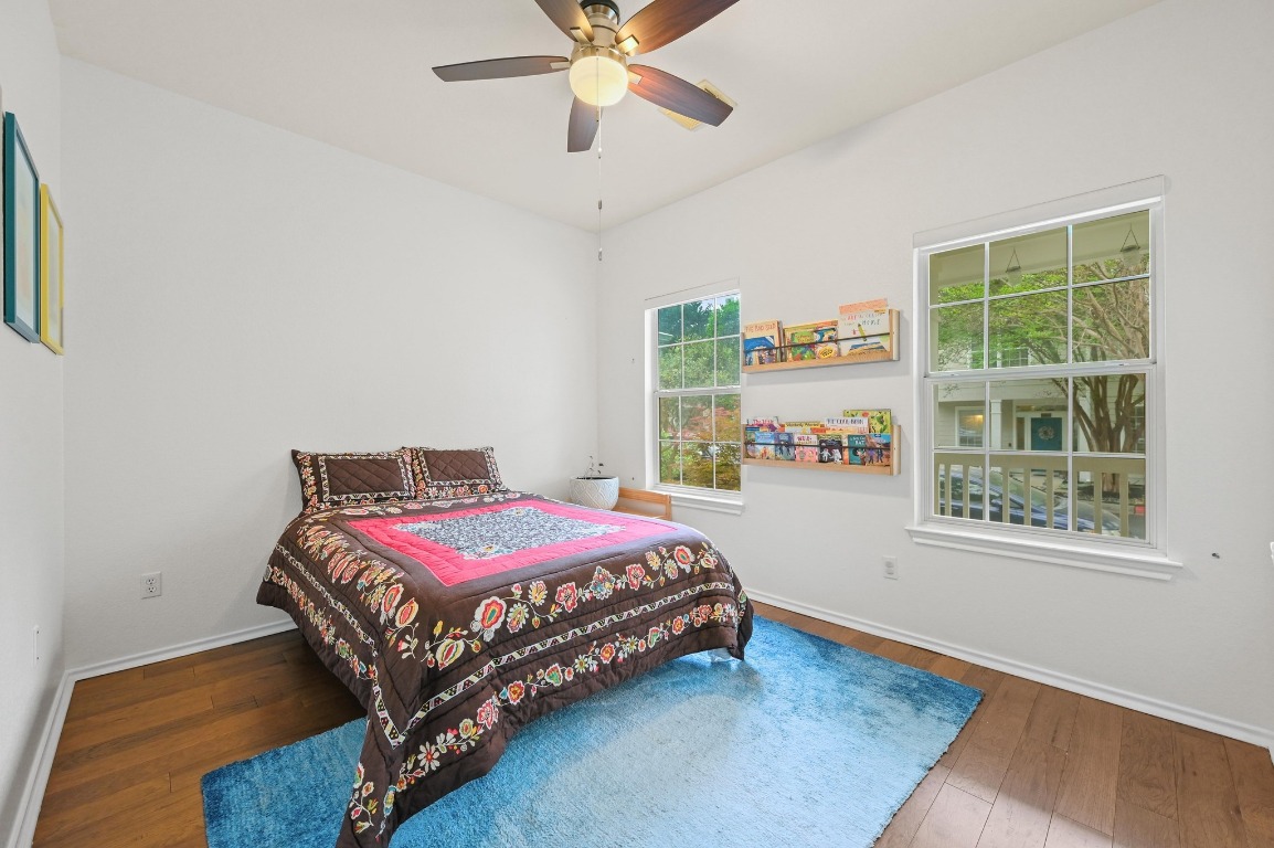 2721 Kinney Oaks Court Austin, TX 78704 - Photo 19 of 28 a bedroom with a bed and a window