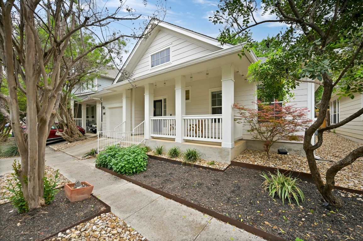 2721 Kinney Oaks Court Austin, TX 78704 - Photo 2 of 28 a front view of a house with garden