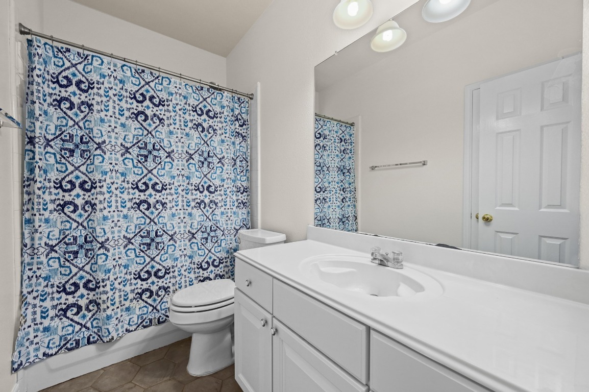 2721 Kinney Oaks Court Austin, TX 78704 - Photo 21 of 28 a bathroom with a sink toilet and shower