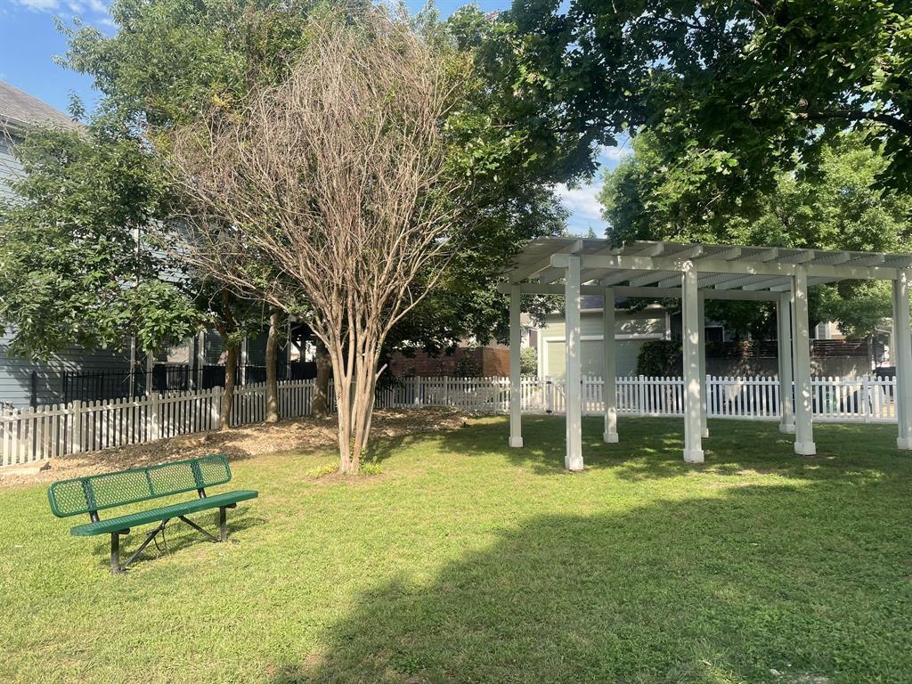2721 Kinney Oaks Court Austin, TX 78704 - Photo 27 of 28 a garden with trees in the background