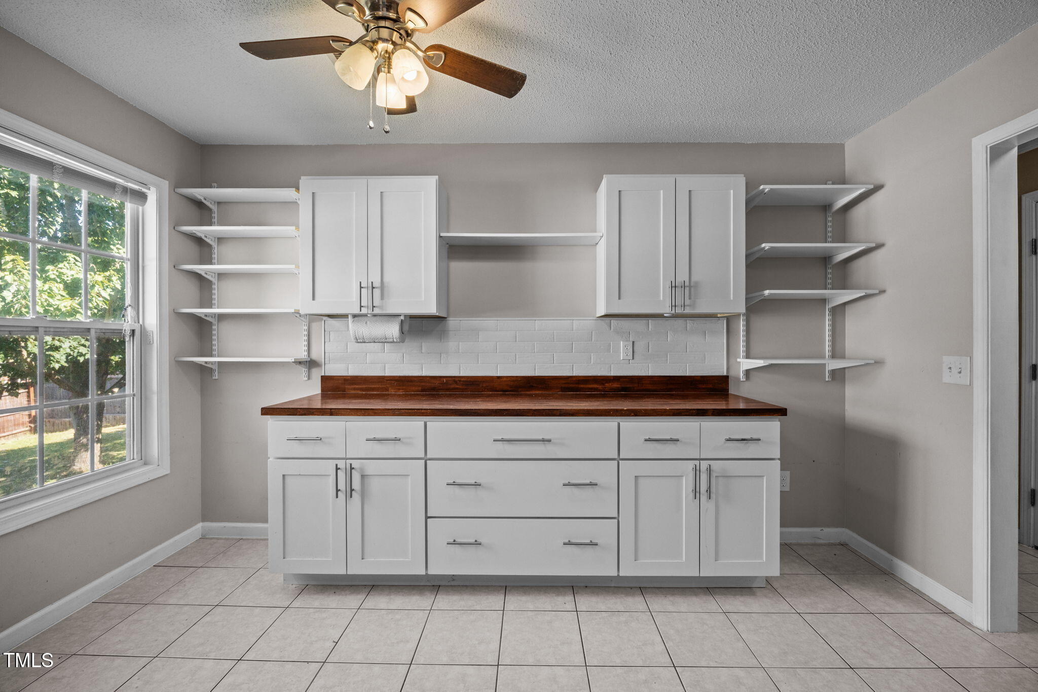 86 Pender Road Spring Lake, NC 28390 - Photo 15 of 35 a kitchen with cabinets and window