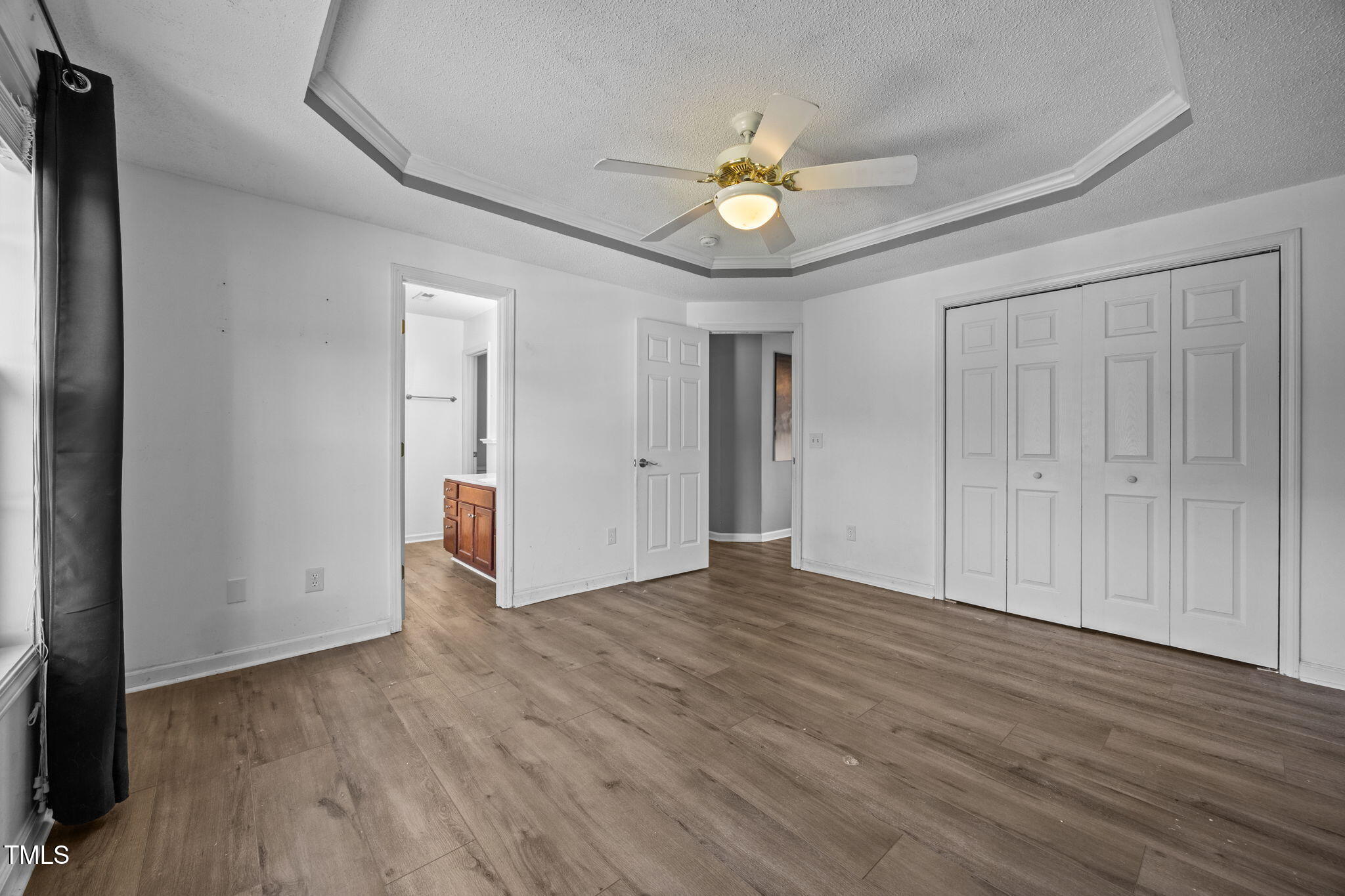 86 Pender Road Spring Lake, NC 28390 - Photo 19 of 35 a view of an empty room with wooden floor