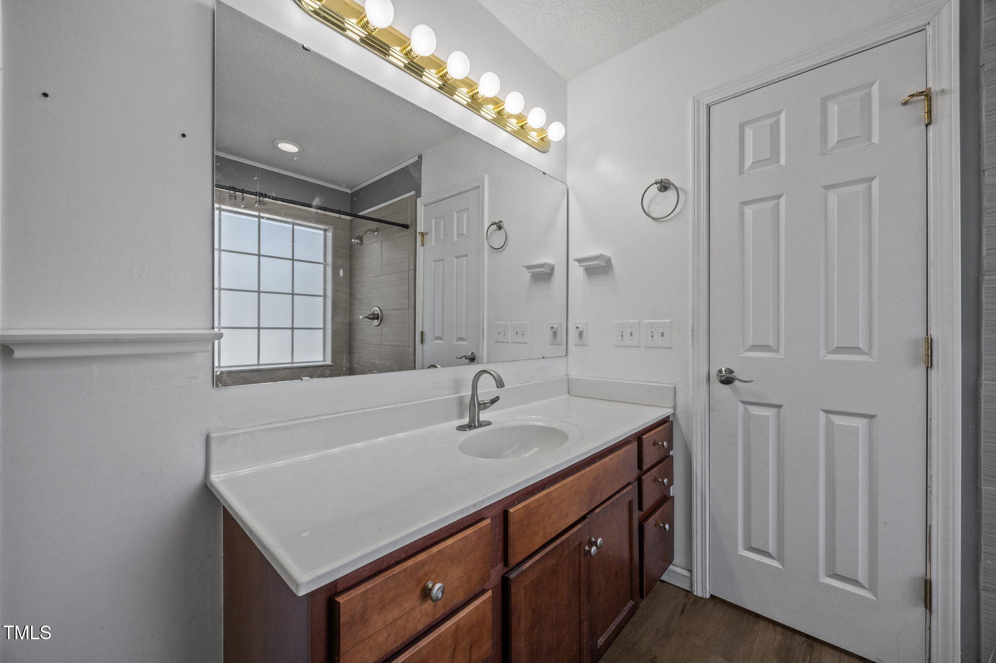 86 Pender Road Spring Lake, NC 28390 - Photo 21 of 35 a bathroom with a sink vanity granite tub and shower