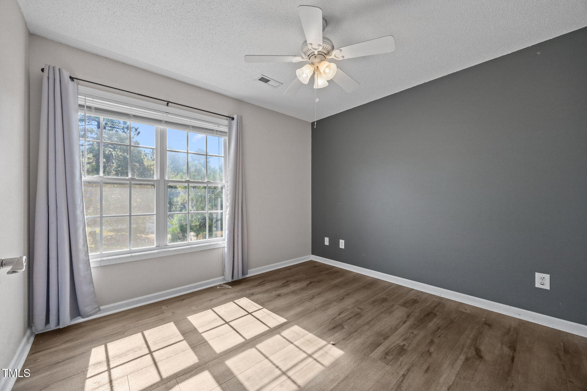 86 Pender Road Spring Lake, NC 28390 - Photo 28 of 35 wooden floor in an empty room with a window
