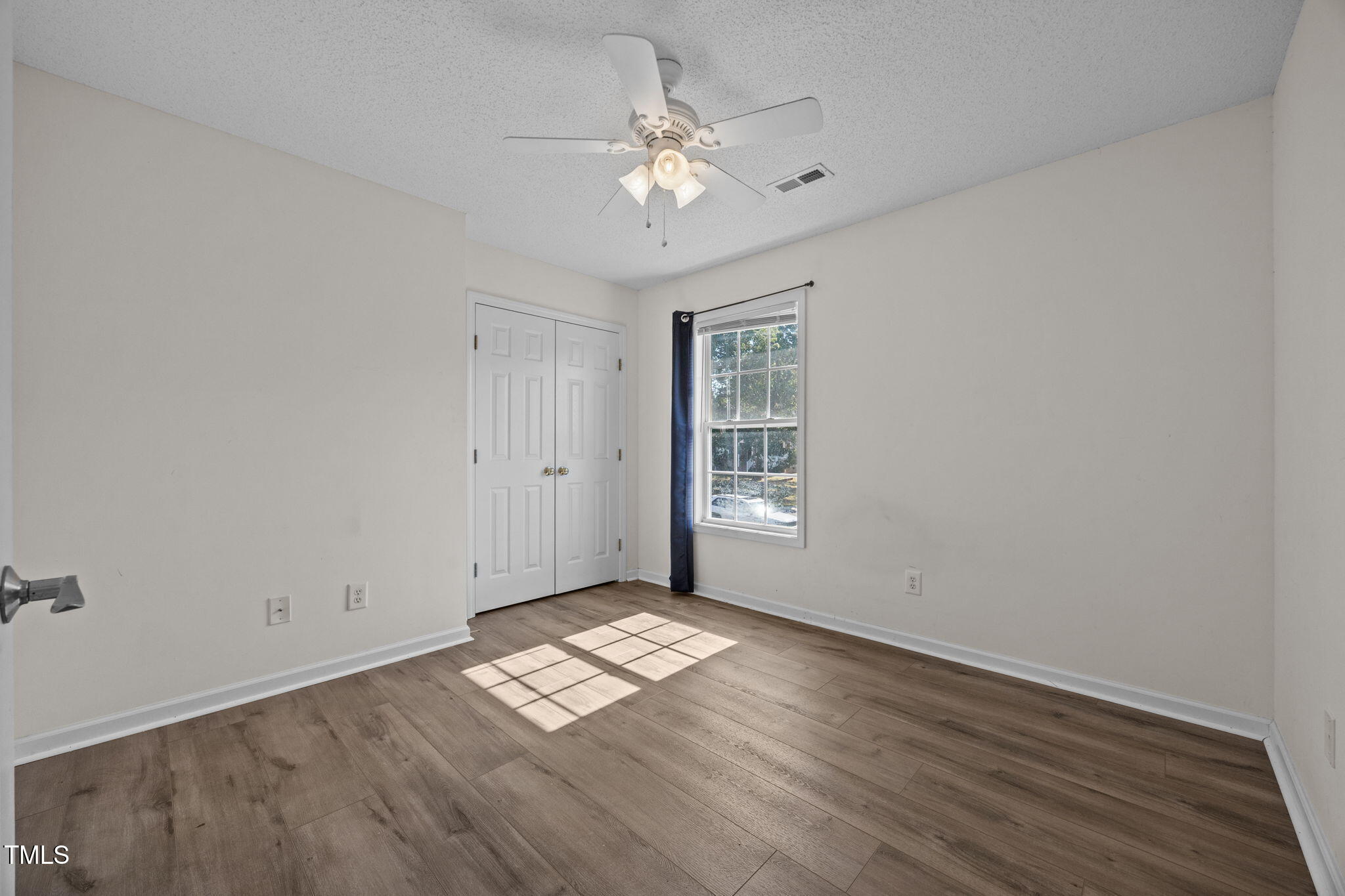 86 Pender Road Spring Lake, NC 28390 - Photo 30 of 35 wooden floor in an empty room with a window