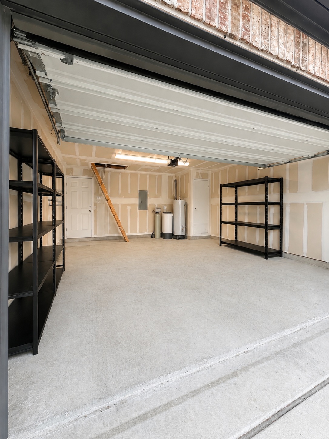 187 Limerick Road Buda, TX 78610 - Photo 18 of 18 A spacious, clean garage provides ample storage and utility access, ready for personal touches.