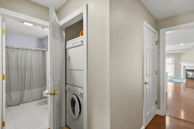 a view of a hallway with washer and dryer