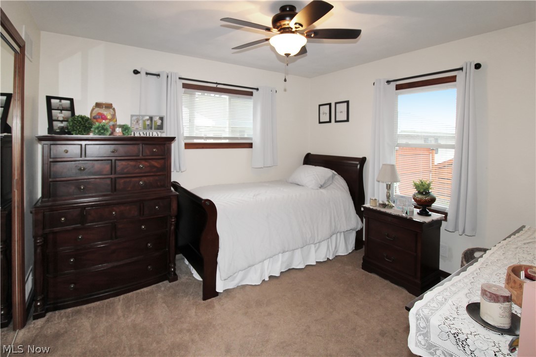 38 Meachem Road Port Clinton, OH 43452 - Photo 9 of 35 Carpeted bedroom featuring multiple windows and ceiling fan