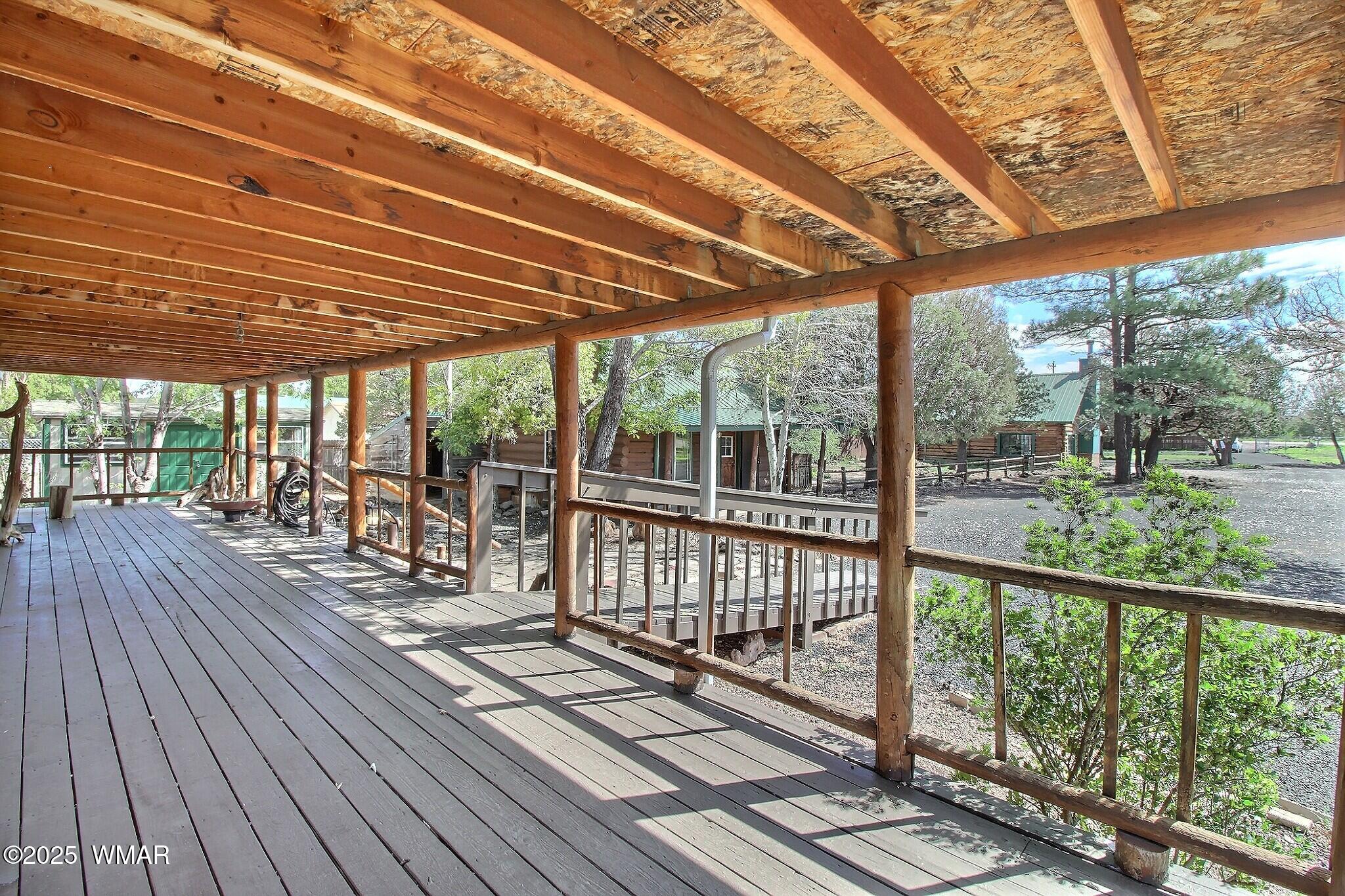 4134 Porter Mountain Road Lakeside, AZ 85929 - Photo 25 of 43 The covered deck provides a relaxing area to sit and view the garden areas or visit with friends and family.