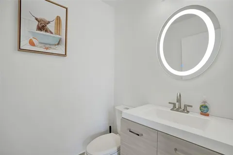 a bathroom with a toilet and a sink