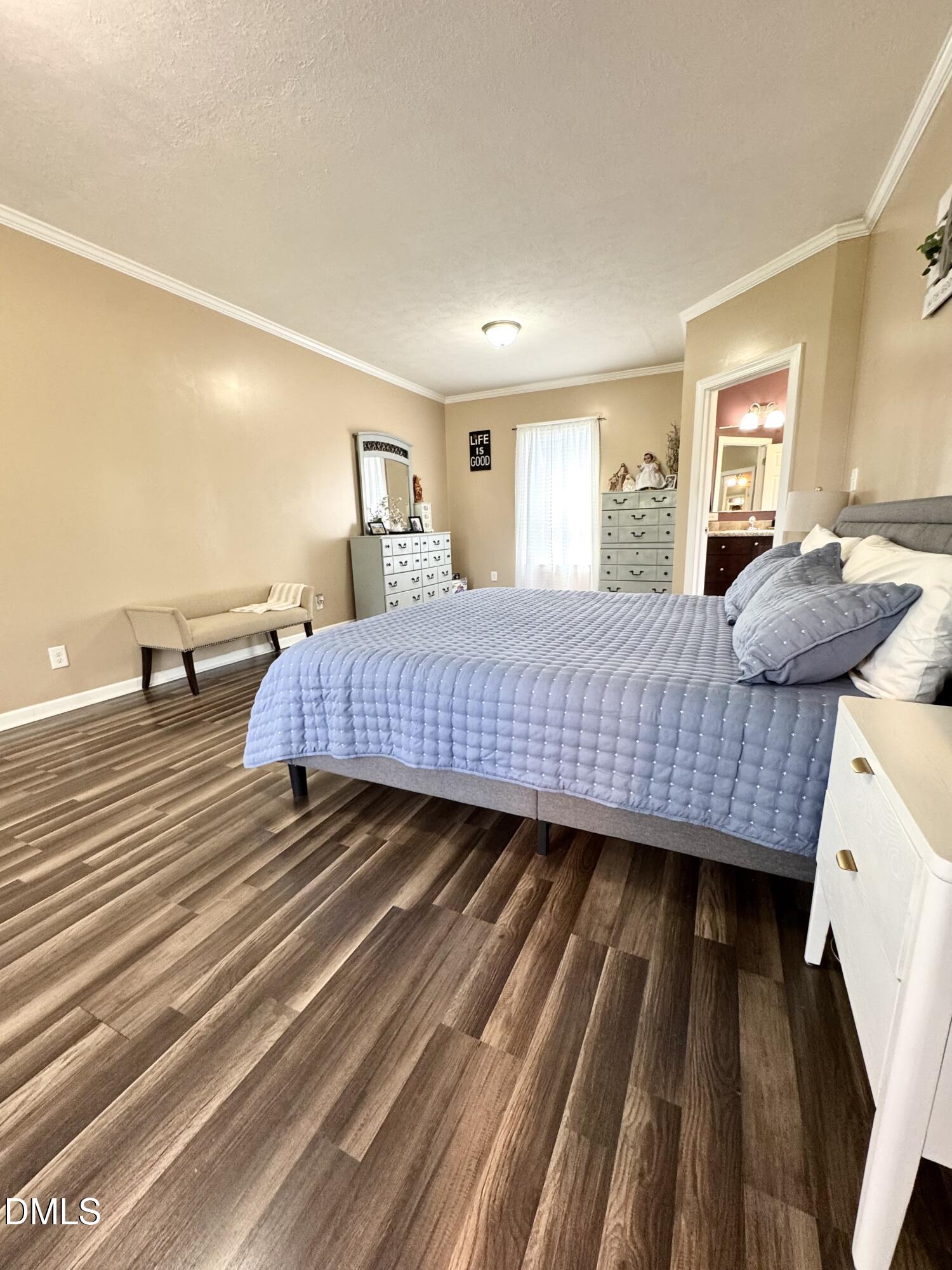 640 Tart Town Road Dunn, NC 28334 - Photo 33 of 71 a bedroom with a bed and wooden floor