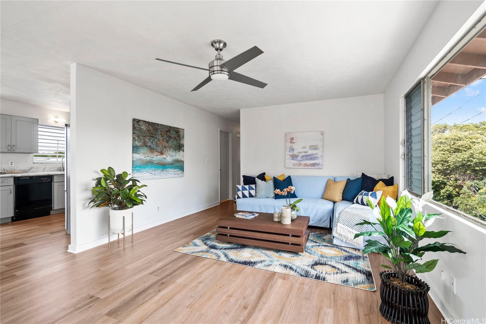 2951 Koali Road Honolulu, HI 96826 - Photo 1 of 1 a living room with furniture and a potted plant