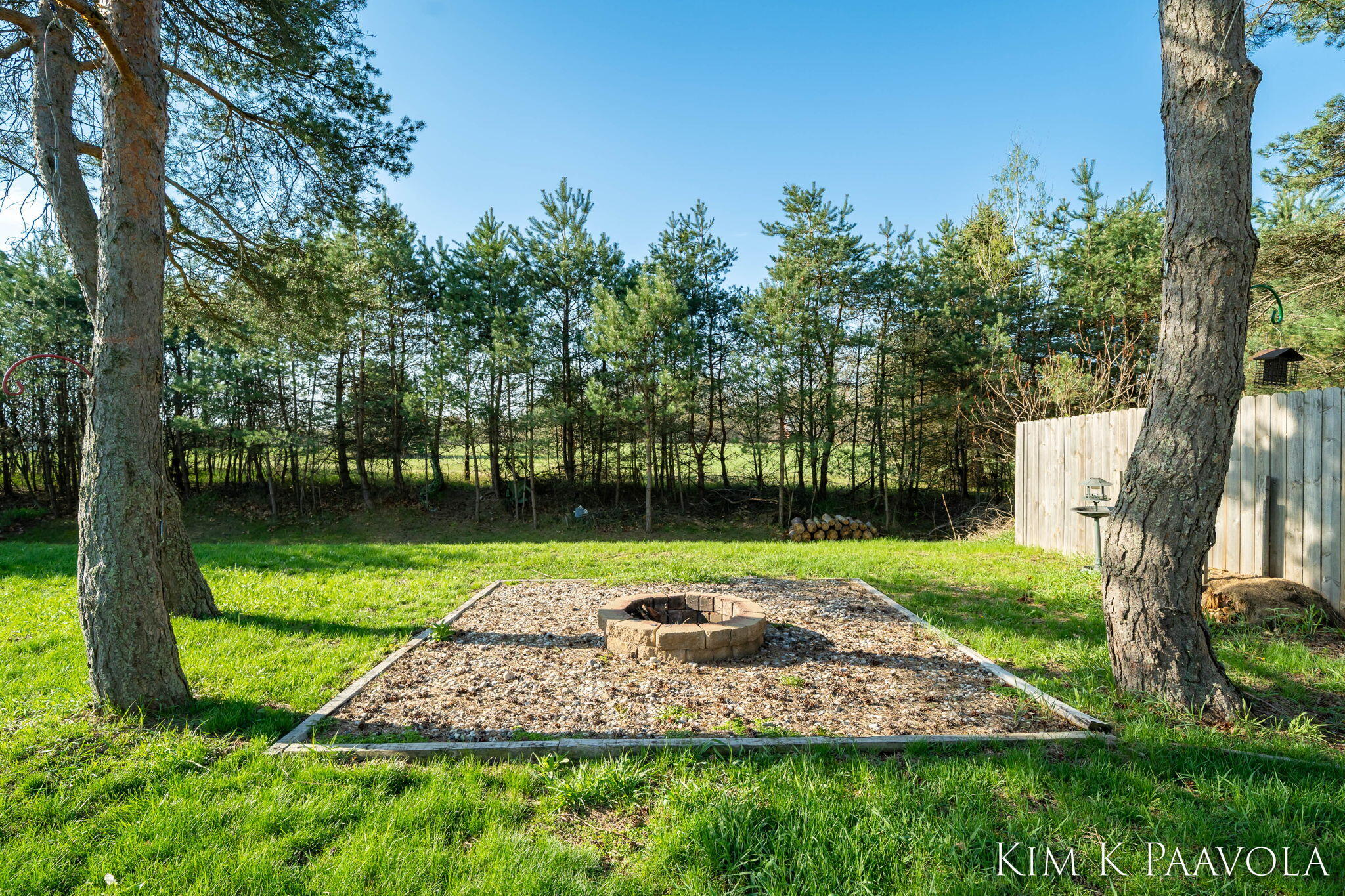 377 Pine Ridge Drive Belding, MI 48809 - Photo 34 of 44 Backyard firepit