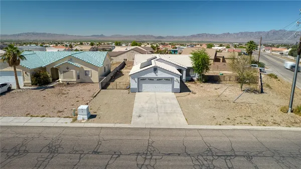an aerial view of a house with a swimming pool