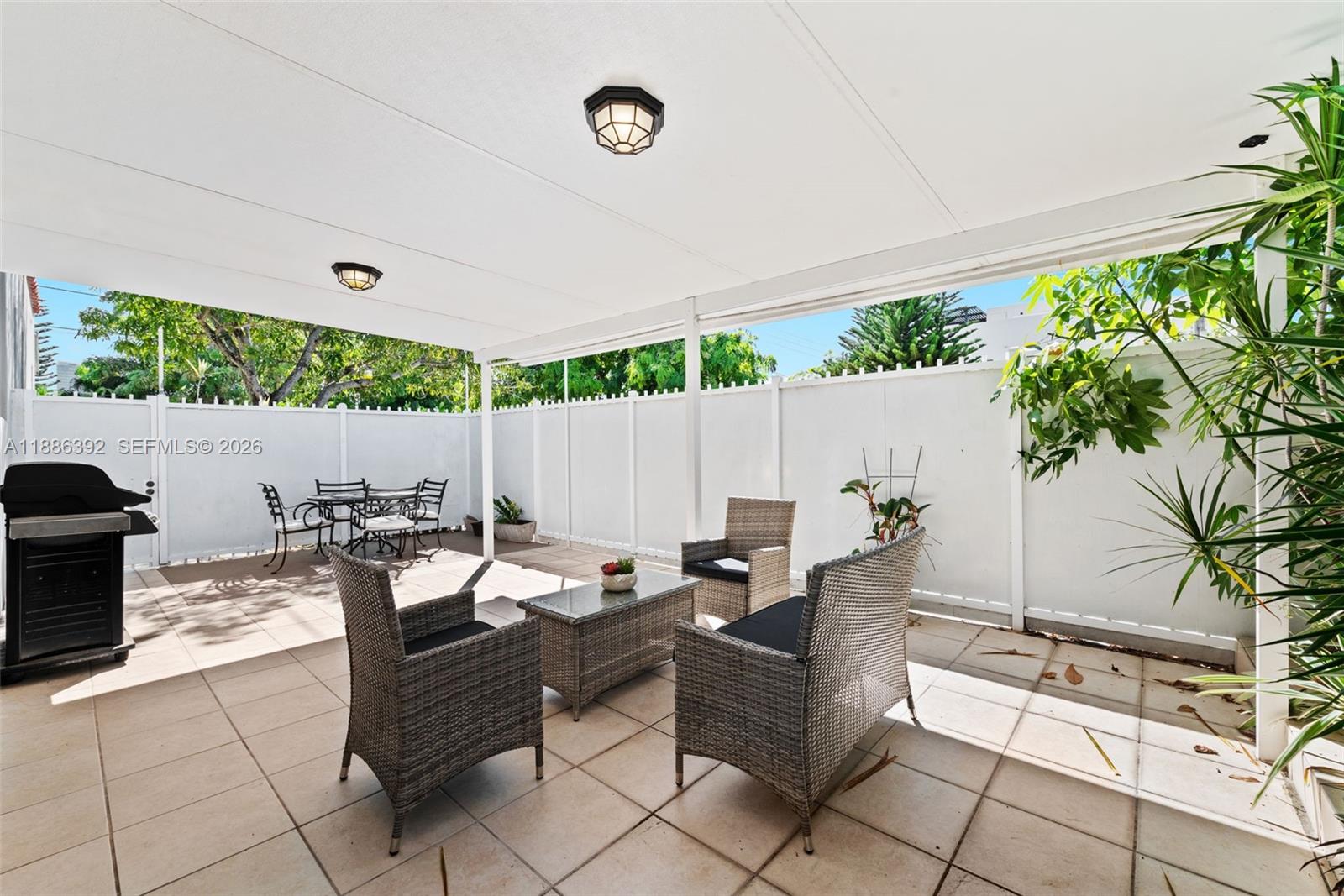 944 Southwest 10th Avenue Miami, FL 33130 - Photo 19 of 30 a outdoor space with lots of tables a garden and a couch
