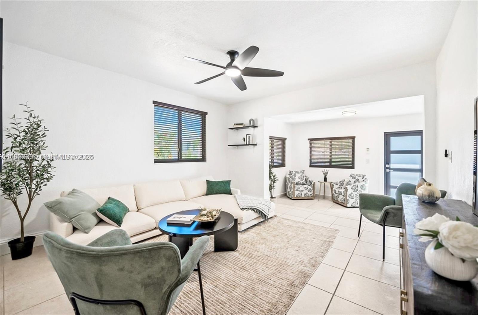944 Southwest 10th Avenue Miami, FL 33130 - Photo 2 of 30 a living room with furniture and a chandelier