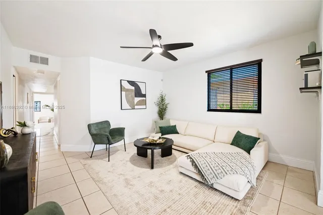 a living room with furniture and a window