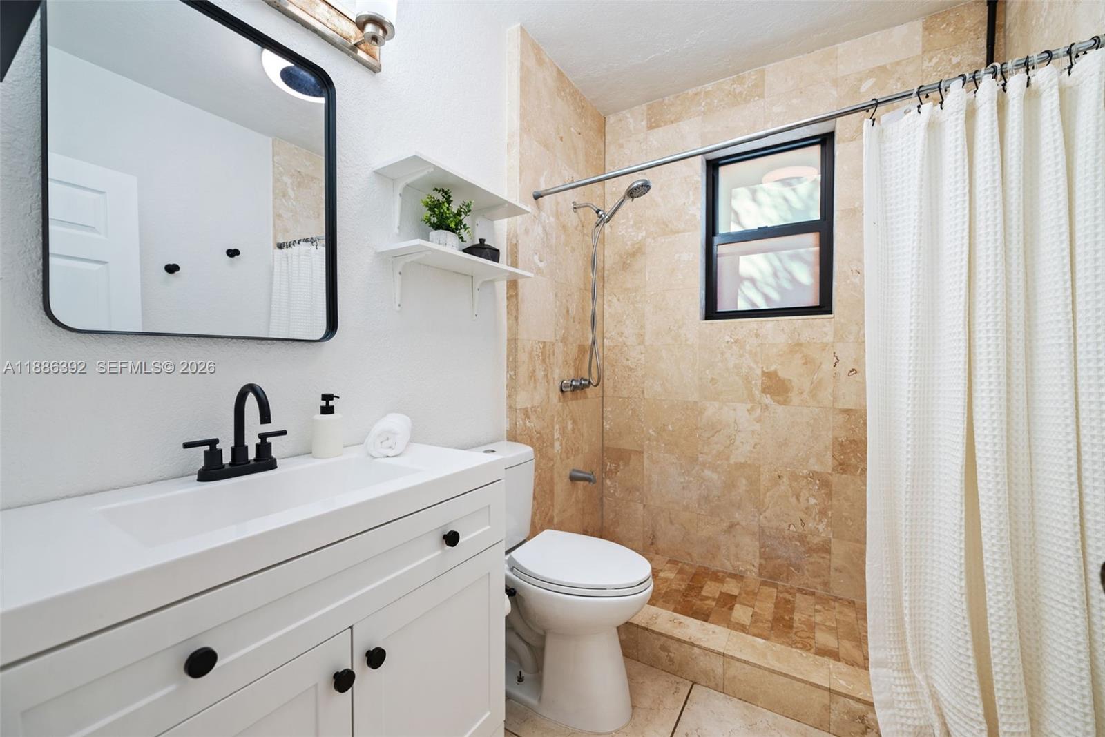 944 Southwest 10th Avenue Miami, FL 33130 - Photo 6 of 30 a bathroom with a sink a toilet and shower