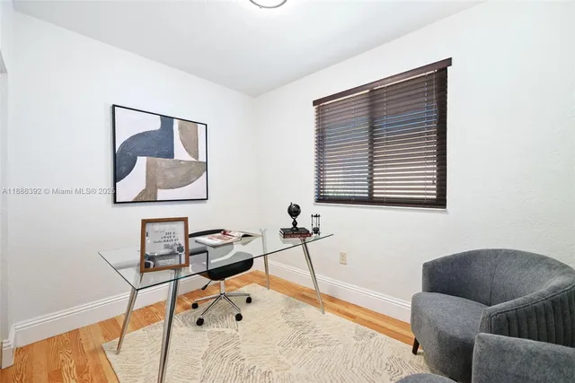 a bedroom with furniture and a window