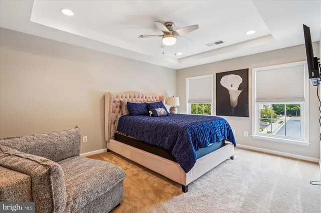 a spacious bedroom with a large bed and a window