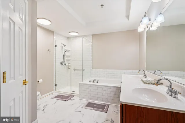 a bathroom with a sink double vanity and a mirror