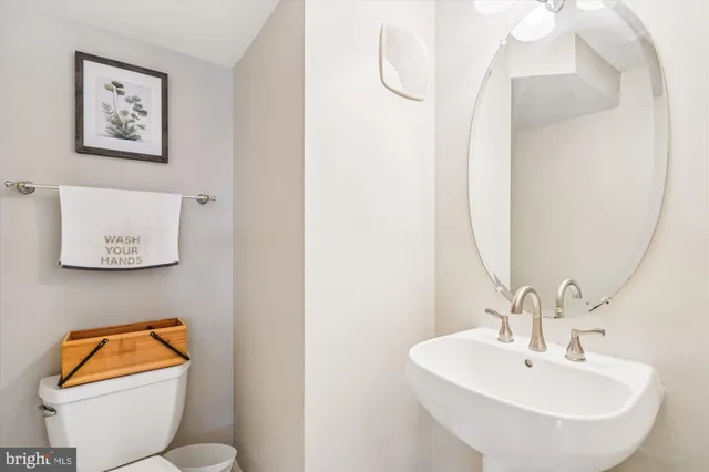 a bathroom with a toilet and a sink