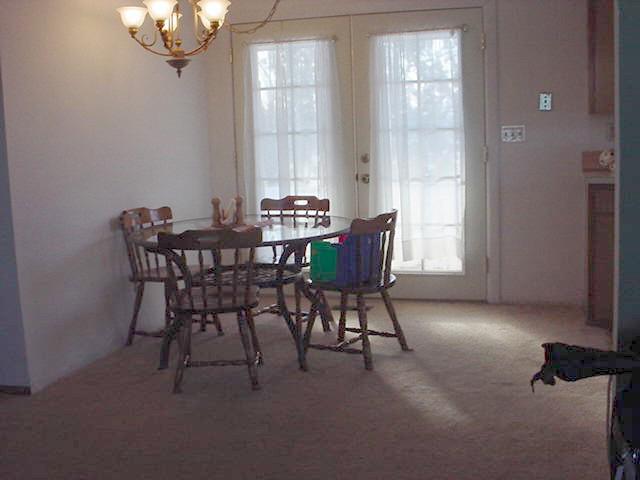 2800 Jones Road Wapato, WA 98951 - Photo 4 of 7 a view of a dining room with furniture and chandelier