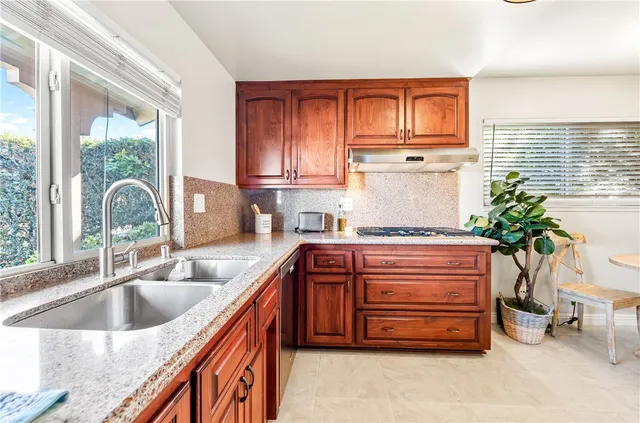a kitchen with a sink and cabinets